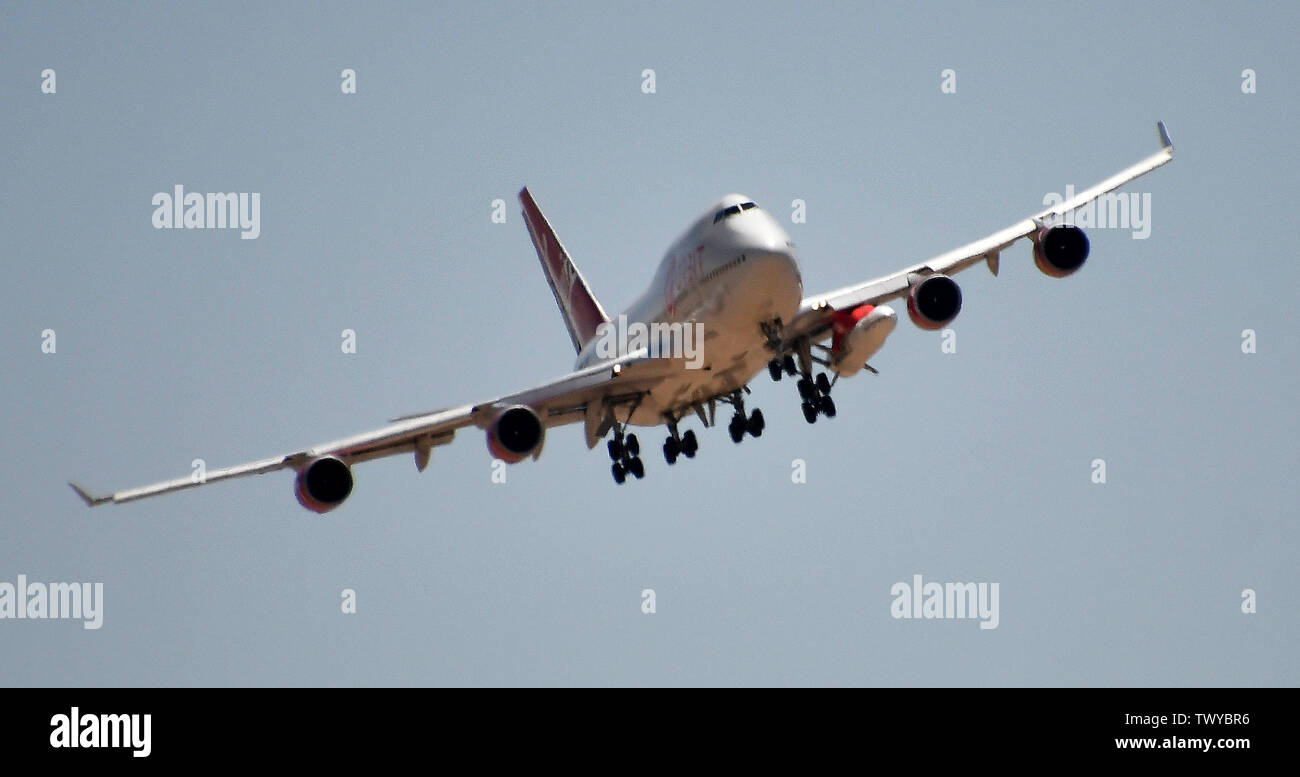 Mojave, California, USA. 23rd June, 2019. Virgin Orbit 747 Cosmic Girl comes in for landing after 4hr test run Sunday morning from Mojave airport California, June 23, 2019. Under it's left wing is the LauncerOne rocket that getting ready for it's first test drop this year. The 747 did a series of test of Zoom Climb Maneuvers off the coast of SoCal and will be leading up to the 1st launch test. Photo by Gene Blevins/ZUMAPRESS Credit: Gene Blevins/ZUMA Wire/Alamy Live News Stock Photo