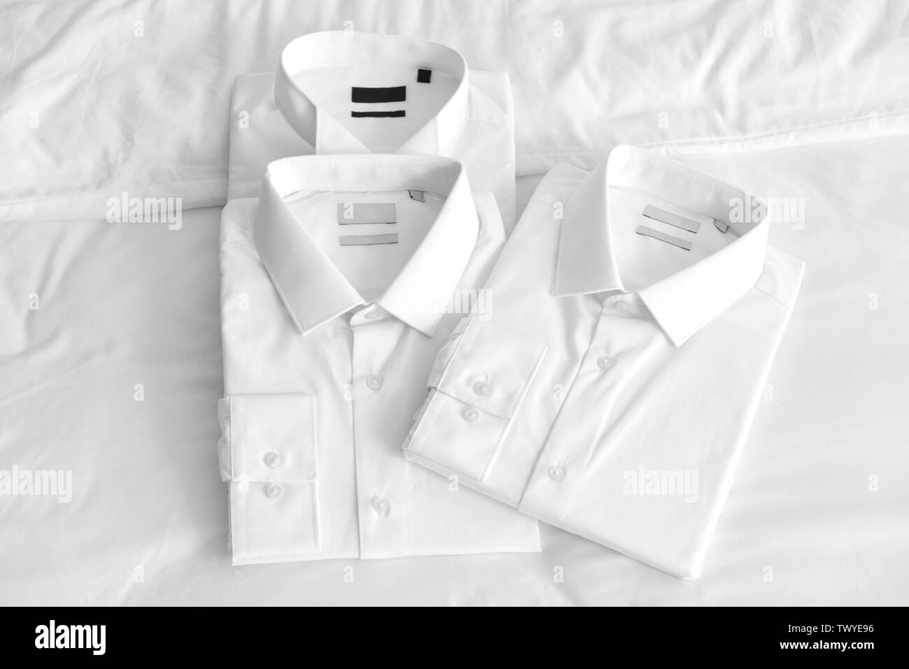 Folded clothes on bed Black and White Stock Photos & Images - Alamy