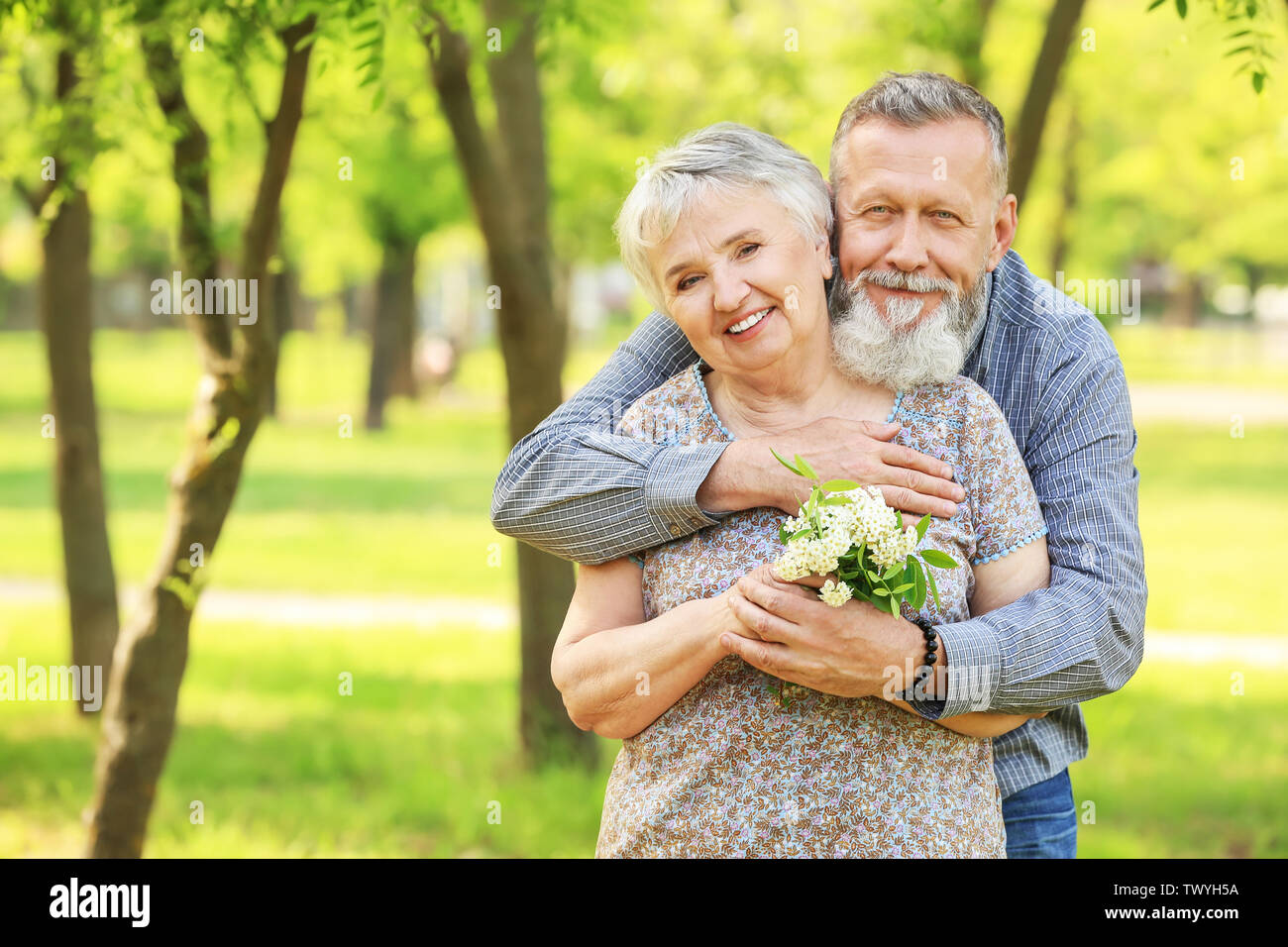 Portrait of happy senior couple in park Stock Photo - Alamy