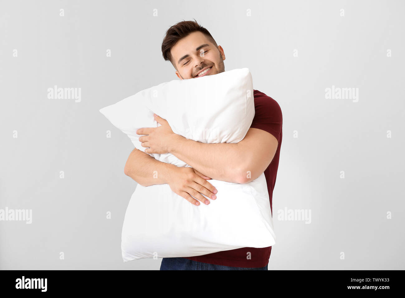 Man hugging sale pillow