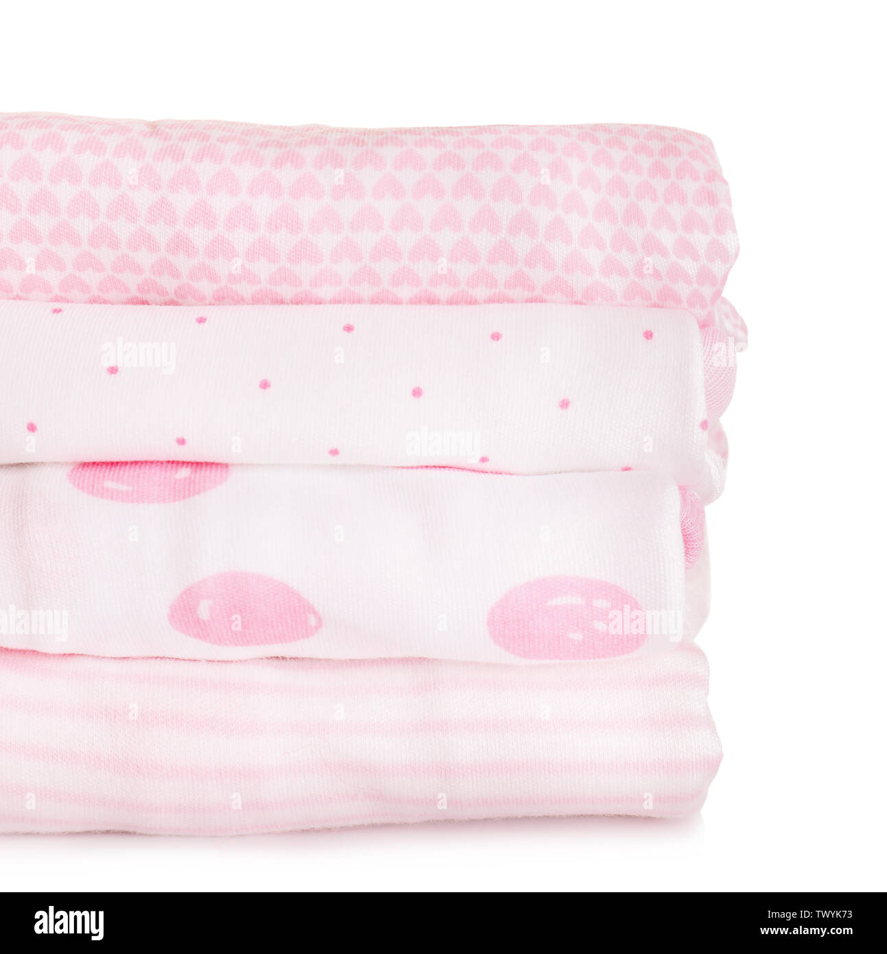 Stack of baby clothes on white background Stock Photo - Alamy
