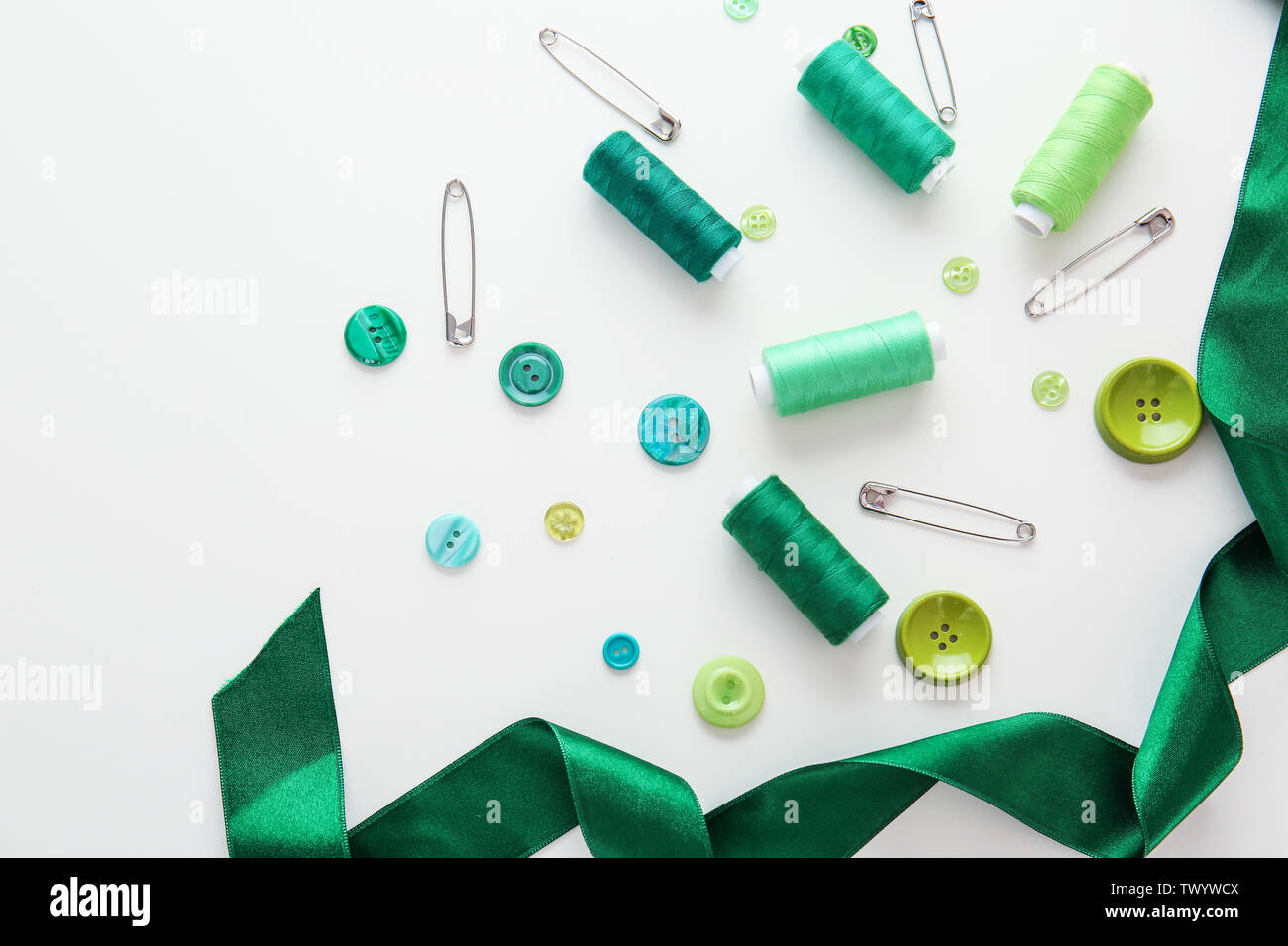 Set of sewing threads and accessories on white background Stock Photo ...