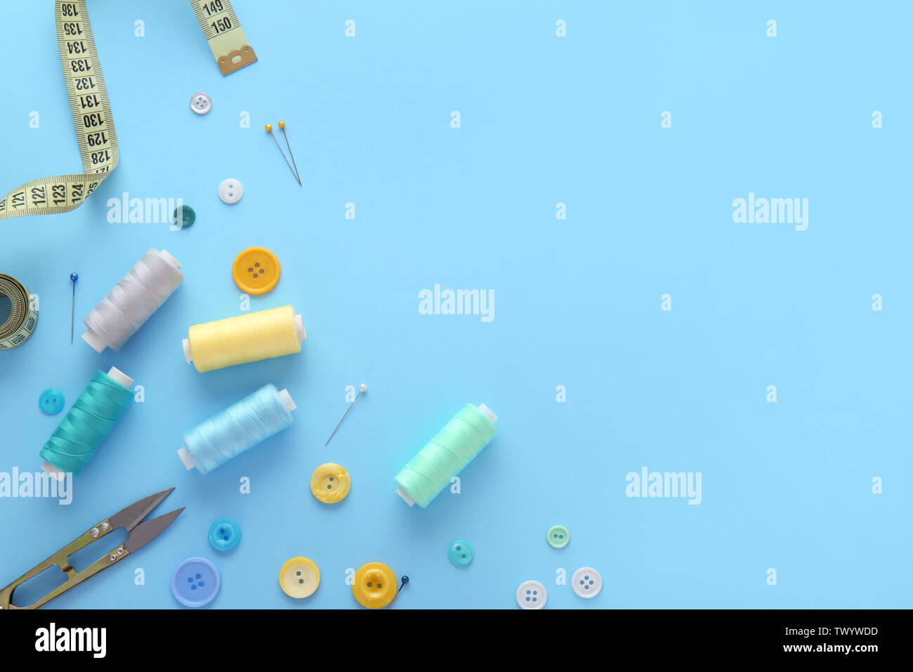 Set of sewing threads and accessories on color background Stock Photo ...