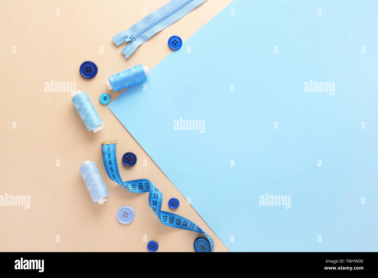 Set of sewing threads and accessories on color background Stock Photo ...