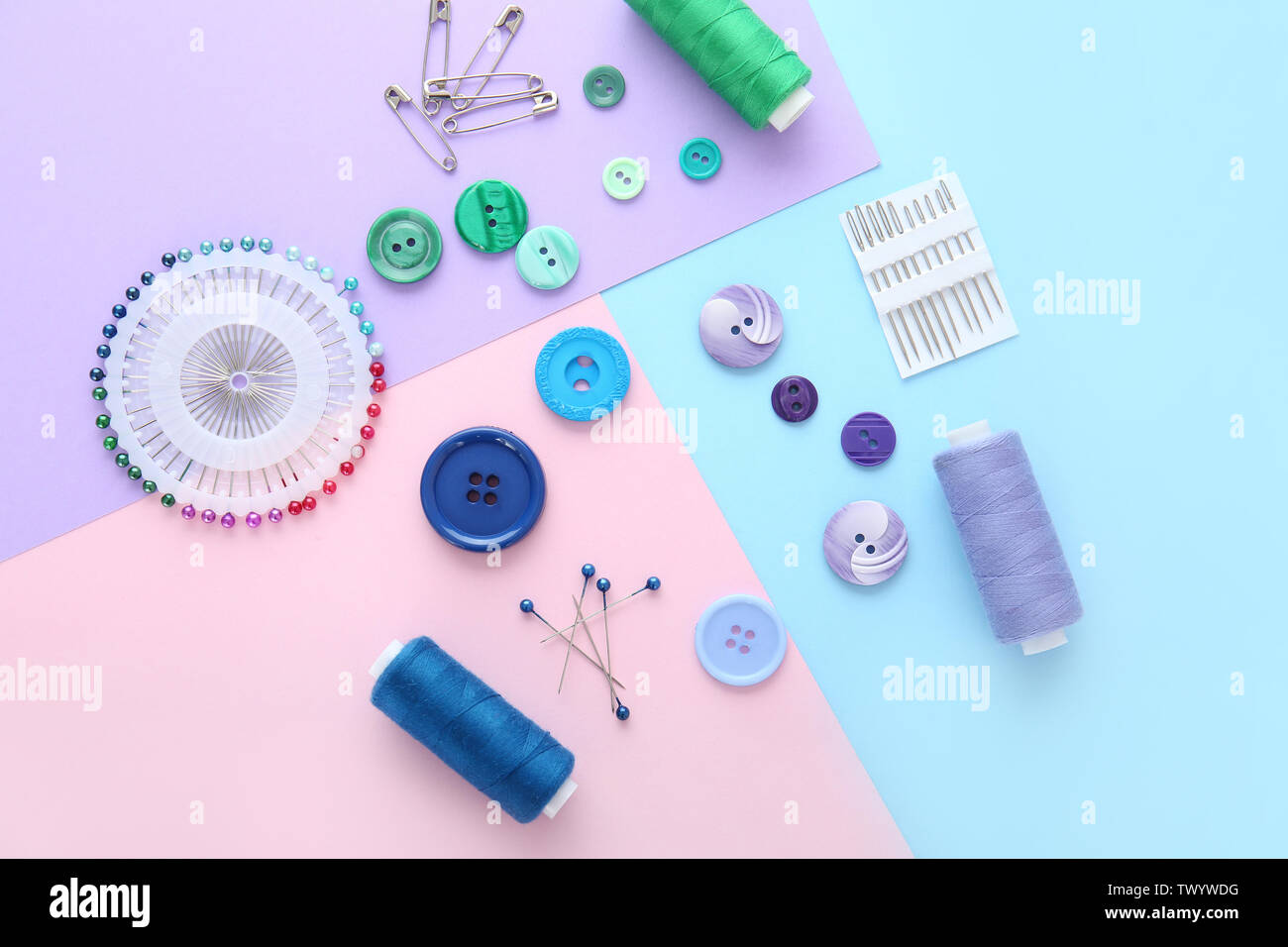 Set of sewing threads and accessories on color background Stock Photo ...