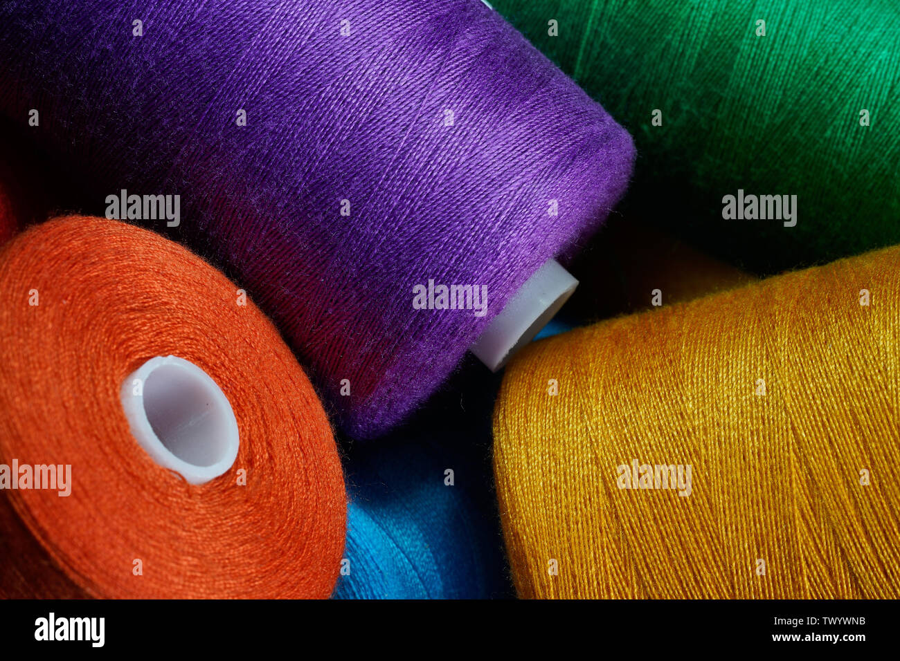 Blue thread. Set of sewing thread coils on white natural fabric with  embroidery. Several reels of thread in different shades of blue. Selective  focus Stock Photo - Alamy
