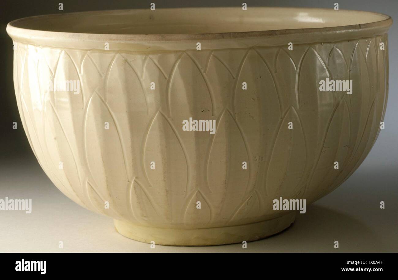 Bowl (Wan) with Floral Spray and Lotus Petals (image 1 of 2);  China, Hebei Province, Quyang County, Northern Song dynasty, 960-1127 Furnishings; Serviceware Ding ware, wheel-thrown stoneware with incised and carved decoration and transparent glaze Purchased with funds provided by Carl Holmes (M.56.3.1) Chinese Art; 960-1127; Stock Photo