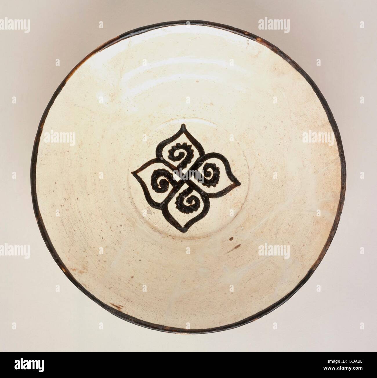 Bowl (image 1 of 3);  Iran, Nishapur, 10th century Furnishings; Serviceware Earthenware, white slip, slip-painted in black Art Museum Council Fund (M.68.22.2) Islamic Art; 10th century date QS:P571,+950-00-00T00:00:00Z/7; Stock Photo