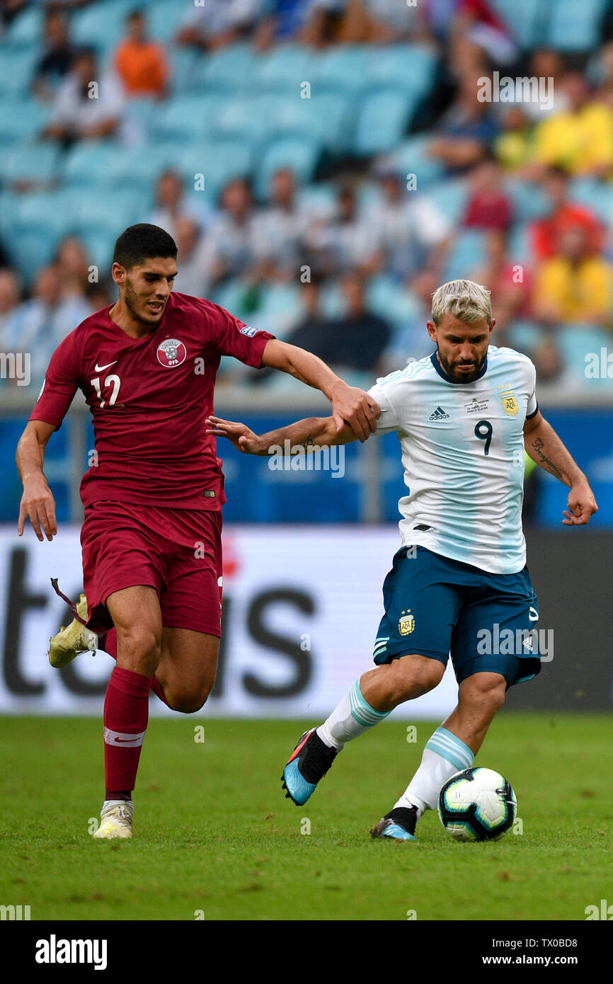 Porto Alegre, Brazil. 23rd June, 2019. Argentina's Sergio Aguero (R) vies with Karim Boudiaf of Qatar during the Group B match between Argentina and Qatar at the Copa America 2019, in Porto Alegre, Brazil, June 23, 2019. Argentina won 2-0. Credit: Xin Yuewei/Xinhua/Alamy Live News Stock Photo