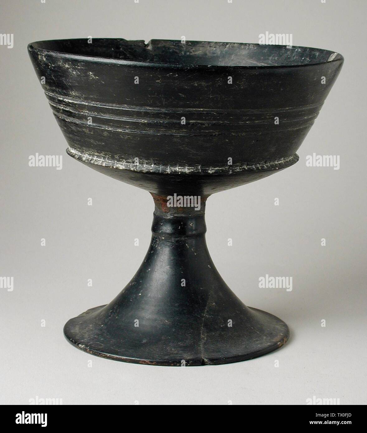 Bucchero Chalice; Furnishings; Serviceware Ceramic 6 x 4 in. (15.24 x 10.16 cm) Gift of Dr. Robert L. St. Martin (AC1995.193.3) Greek, Roman and Etruscan Art; 6th century BC date QS:P571,-550-00-00T00:00:00Z/7; Stock Photo