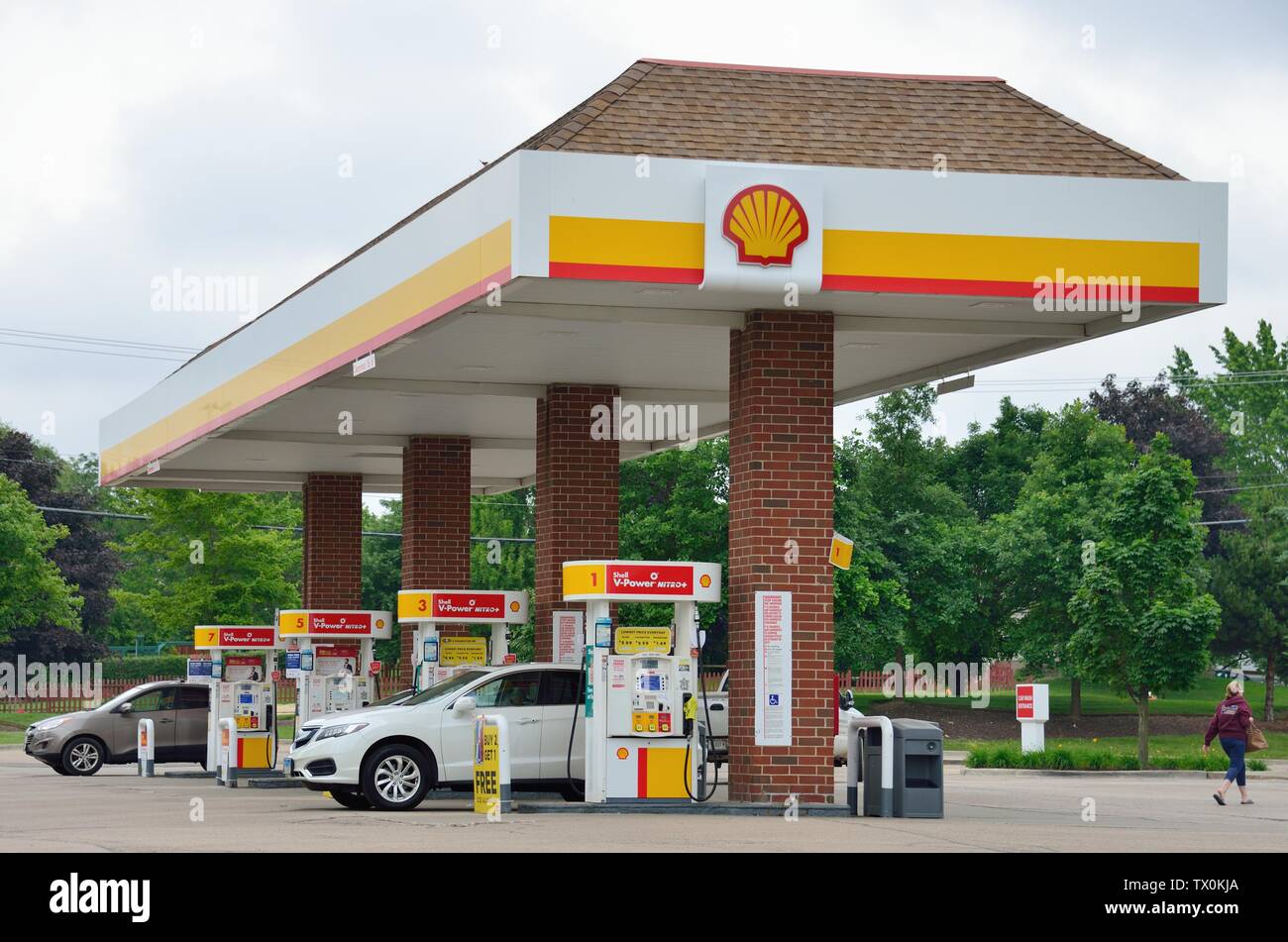 Bartlett, Illinois, USA. Gas pumps on service islands at a modern self-service gas station. Stock Photo