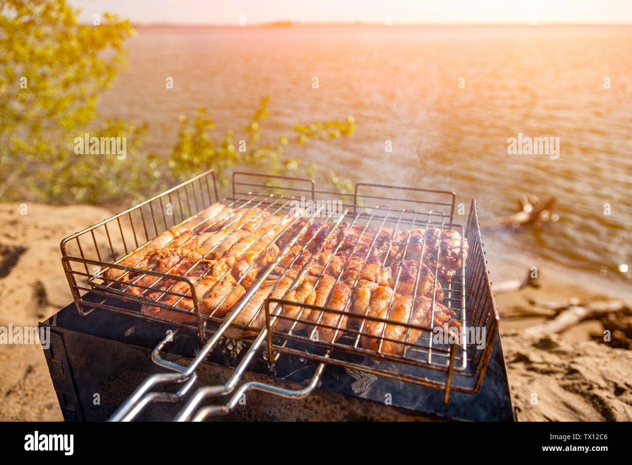 Chiken on the grill against the background of the sea and the beach- paleo  food photography.Delicious chiken steak, hot barbecue grill.Roasted chiken  Stock Photo - Alamy