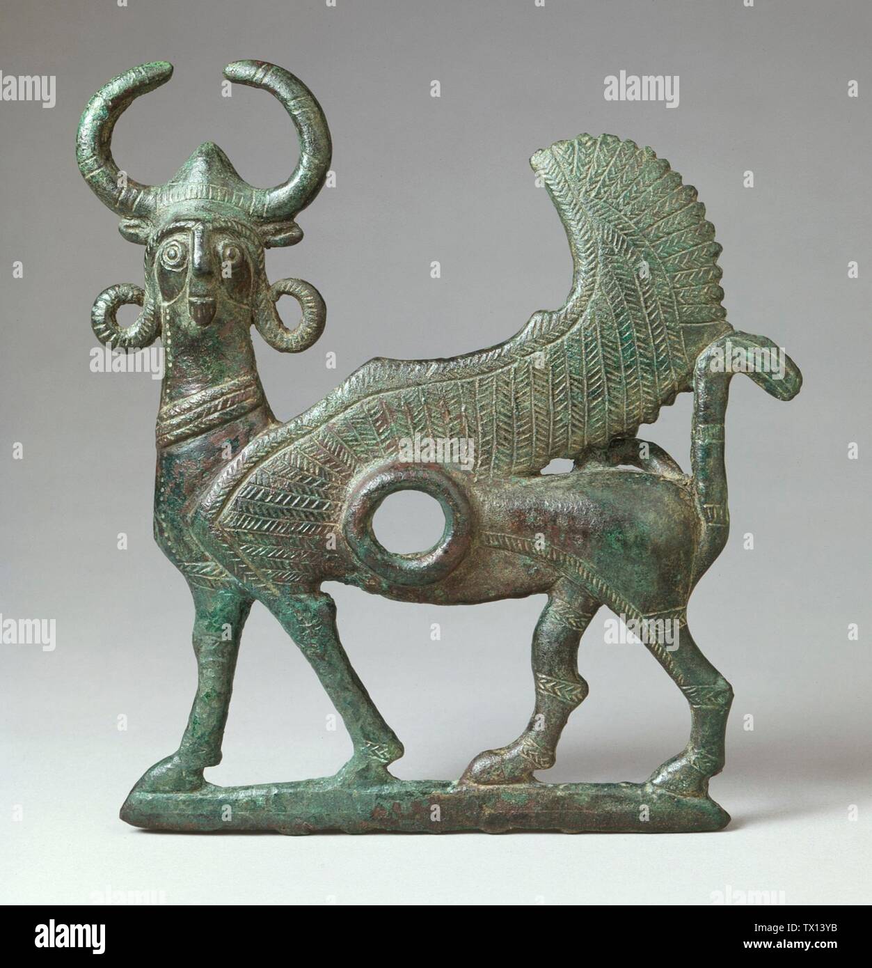 Cheek Piece from a Horse Bit; Iran, Bronze du Luristan, circa 1000-800 B.C. Tools and Equipment; horse trappings Bronze 7 1/4 x 6 1/2 in. (18.5 x 16.7 cm) The Nasli M. Heeramaneck Collection of Ancient Near Eastern and Central Asian Art, gift of The Ahmanson Foundation (M.76.97.99) Art of the Ancient Near East Currently on public view: Hammer Building, floor 3; between circa 1000 and circa 800 B.C.; Stock Photo