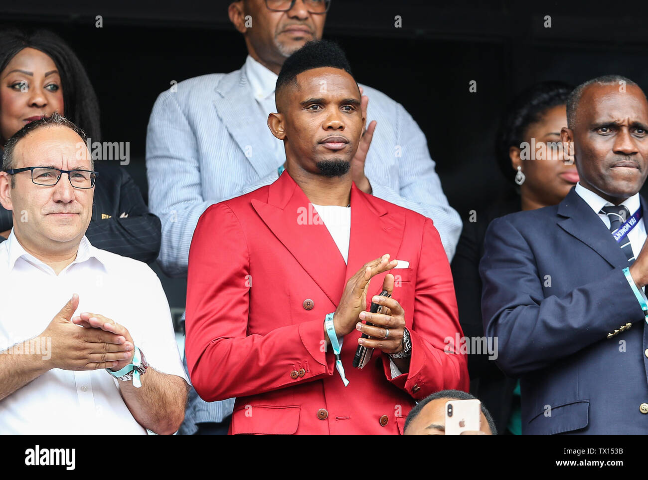 Valenciennes, France. 23rd June, 2019. Former football player of Cameroon Samuel Eto'o reacts during a round of 16 match between England and Cameroon at the 2019 FIFA Women's World Cup in Valenciennes, France, June 23, 2019. England won 3-0. Credit: Shan Yuqi/Xinhua/Alamy Live News Stock Photo