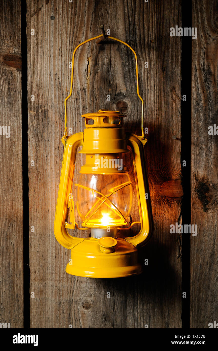 The old kerosene lantern hanging on the wooden wall Stock Photo Alamy