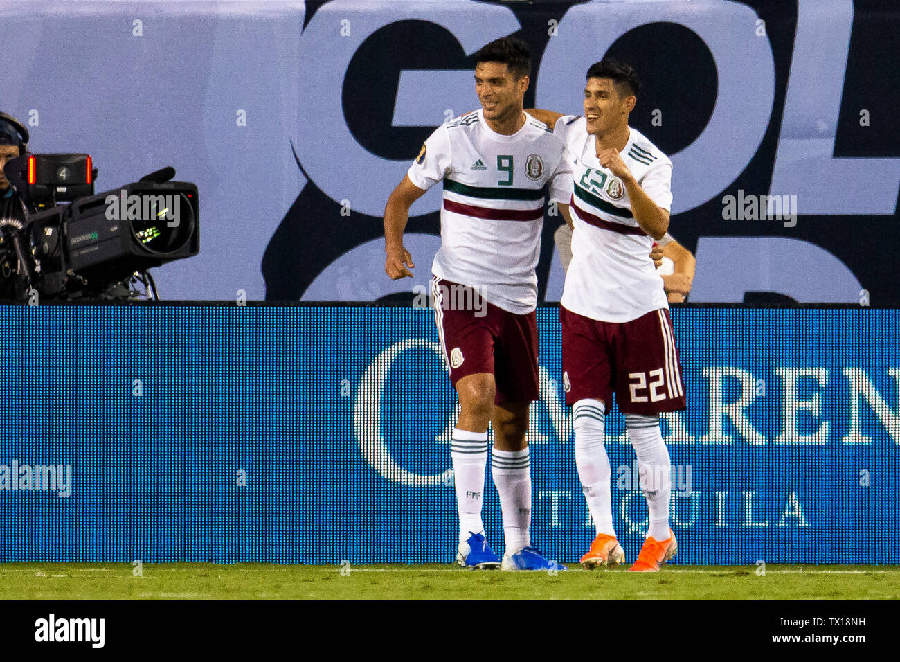 Charlotte, NC, USA. 23rd June, 2019. Mexico forward Raul Jimenez (9) celebrates with defender Jorge Sanchez (22) after scoring in the 2019 Gold Cup match at Bank of America Stadium in Charlotte, NC. (Scott Kinser) Credit: csm/Alamy Live News Stock Photo