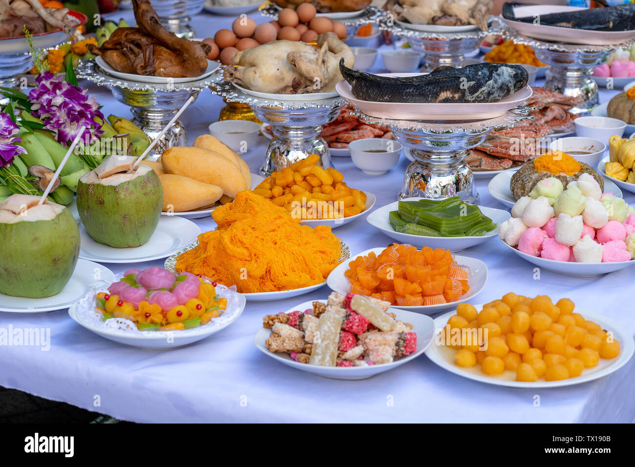 Sacrificial offering food for pray to god and memorial to ancestor, Bangkok, Thailand. Close up. Traditional offerings to gods with food, vegetable an Stock Photo