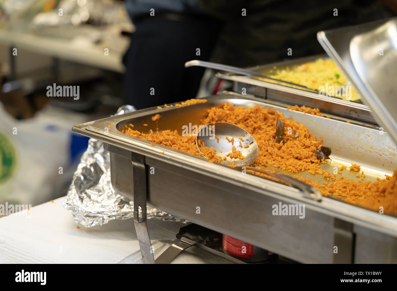 Chaffing Dish with Jollof and Vegetable fried rice at Nigerian Party