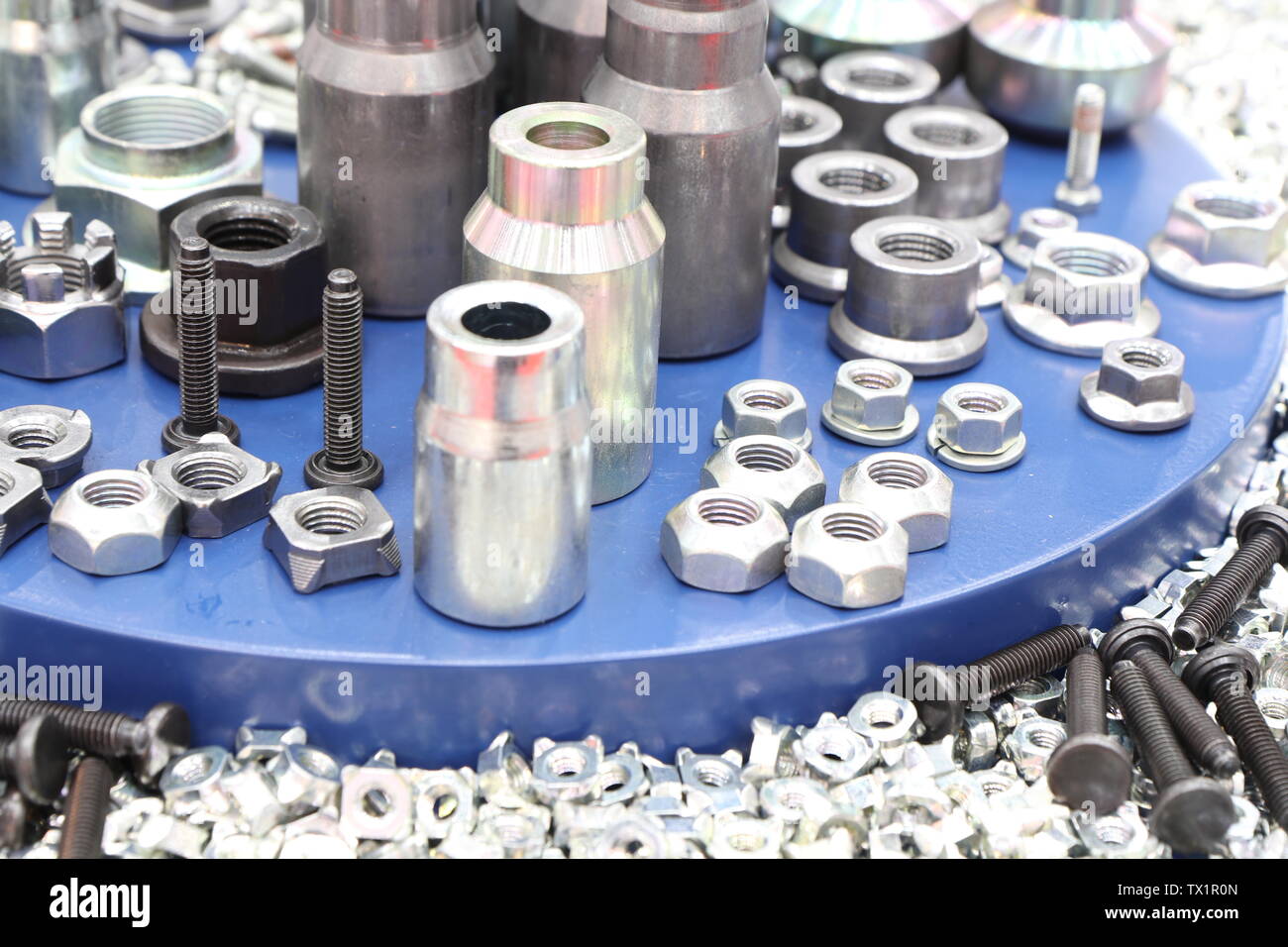 small bolts and nuts by manufacturing process ; tapping Stock Photo Alamy