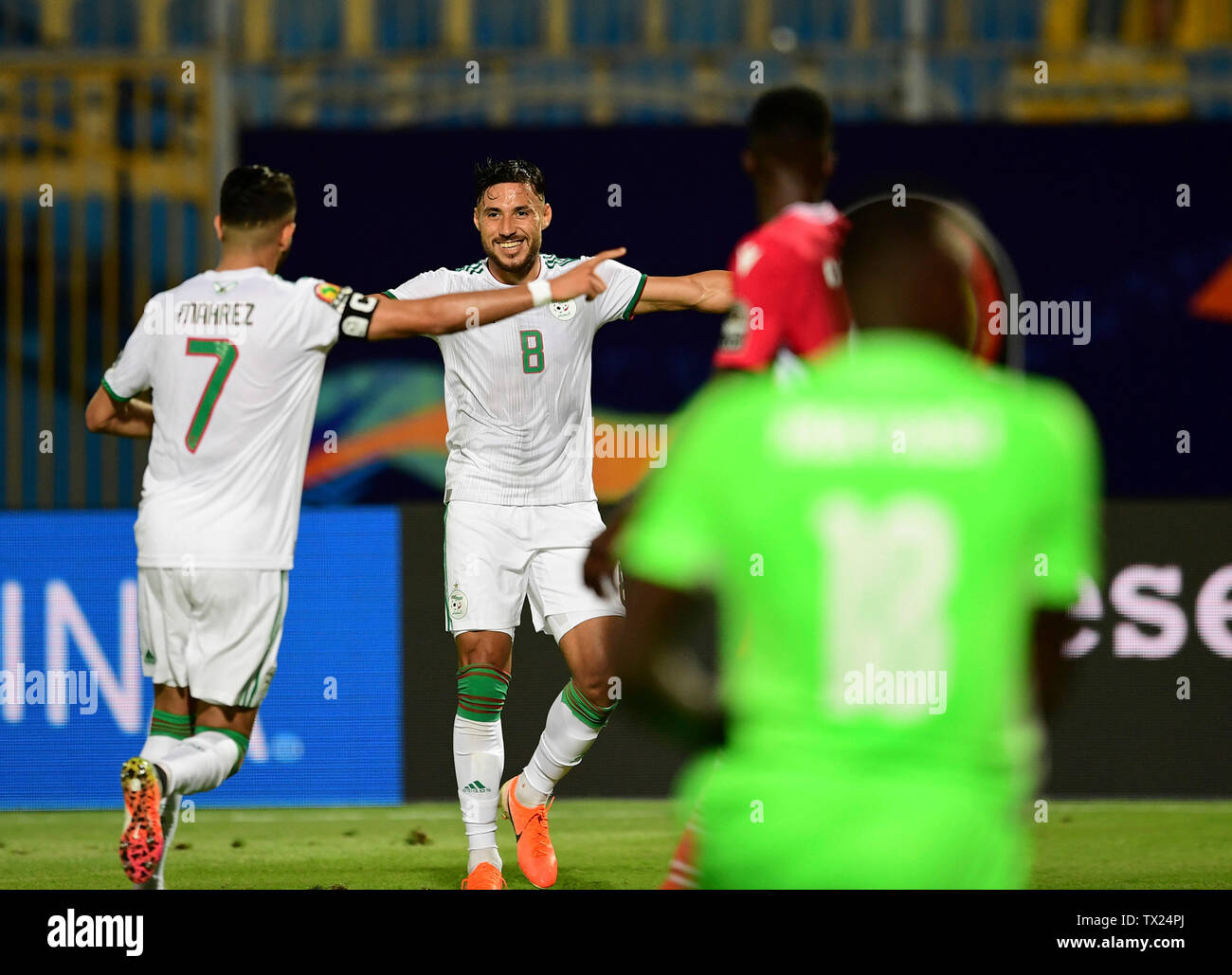 Cairo. 23rd June, 2019. Riyad Mahrez (1st L) of Algeria celebrates scoring with teammates during the 2019 African Cup of Nations Group C match between Algeria and Kenya in Cario, Egypt on June 23, 2019. Algeria won 2-0. Credit: Wu Huiwo/Xinhua/Alamy Live News Stock Photo