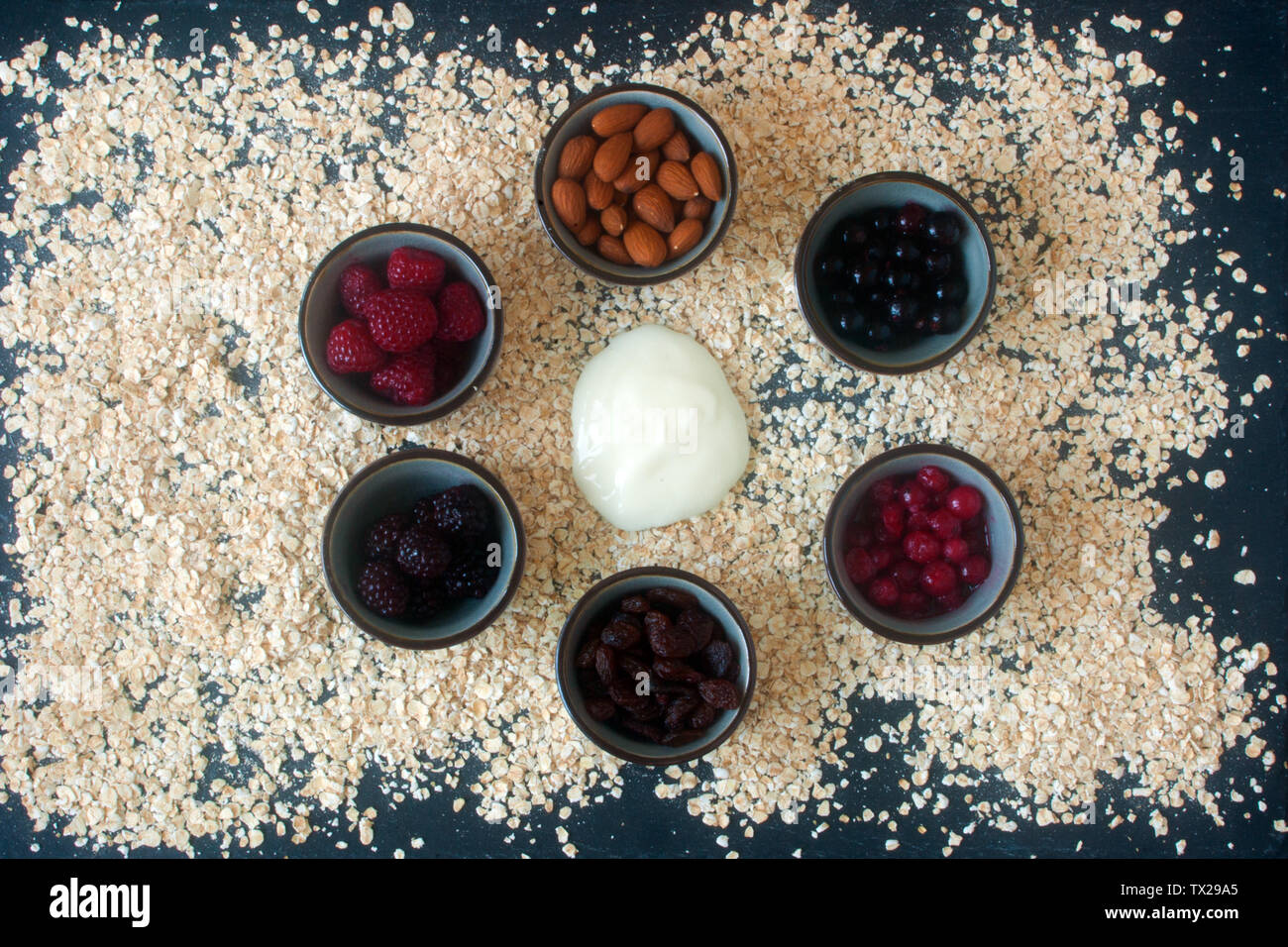 Bowls with ingredients for cereals Stock Photo