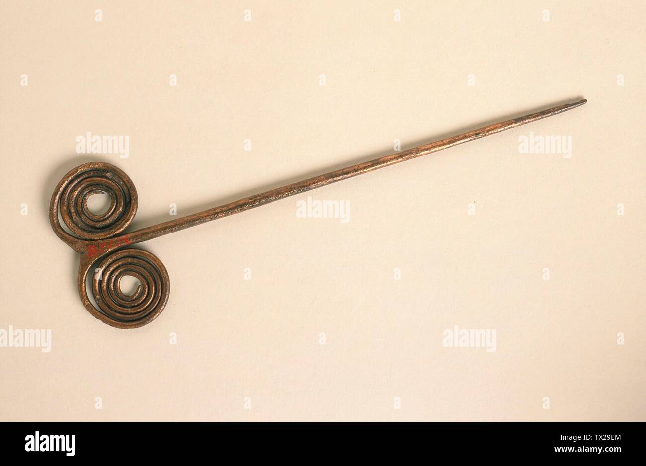 Double-Spiral Pin; Eastern Europe, Chalcolithic period, circa 5000 B.C. Jewelry and Adornments; pins Copper, hammered 7 5/8 x 2 3/8 in. (19.4 x 6.2 cm) The Nasli M. Heeramaneck Collection of Ancient Near Eastern and Central Asian Art, gift of The Ahmanson Foundation (M.76.97.672) Art of the Ancient Near East; circa 5000 date QS:P571,+5000-00-00T00:00:00Z/9,P1480,Q5727902 B.C.; Stock Photo