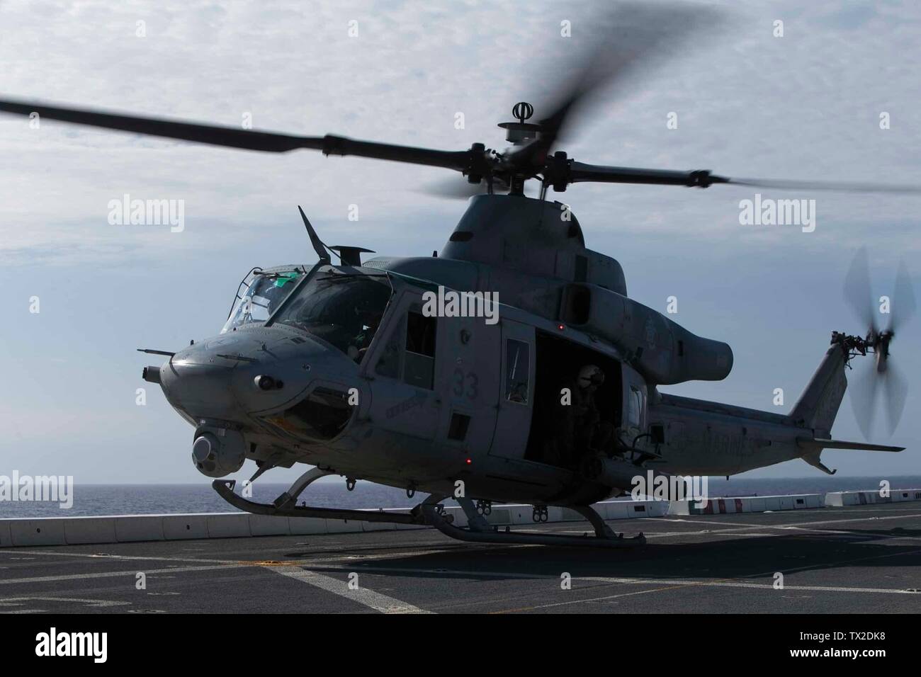 A UH-1Y Huey helicopter with Marine Medium Tiltrotor Squadron 265 (Reinforced) ascends from the flight deck aboard the amphibious transport dock USS Green Bay (LPD 20), underway in the East China Sea, June 4, 2019. The 31st Marine Expeditionary Unit, the Marine Corps’ only continuously forward-deployed MEU, provides a flexible and lethal force ready to perform a wide range of military operations as the premier crisis response force in the Indo-Pacific region. (U.S. Marine Corps photo by Lance Cpl. Kyle P. Bunyi) Stock Photo