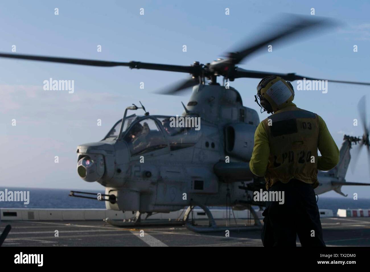 An AH-1Z Viper helicopter with Marine Medium Tiltrotor Squadron 265 (Reinforced) sits on the flight deck aboard the amphibious transport dock USS Green Bay (LPD 20), underway in the East China Sea, June 3, 2019. The 31st Marine Expeditionary Unit, the Marine Corps’ only continuously forward-deployed MEU, provides a flexible and lethal force ready to perform a wide range of military operations as the premier crisis response force in the Indo-Pacific region. (U.S. Marine Corps photo by Lance Cpl. Kyle P. Bunyi) Stock Photo