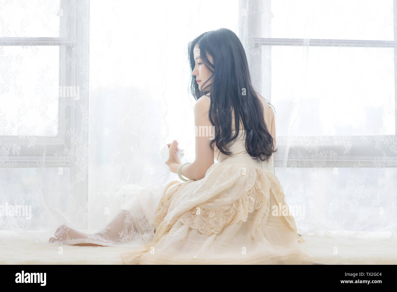 Wearing a white skirt hi-res stock photography and images - Alamy