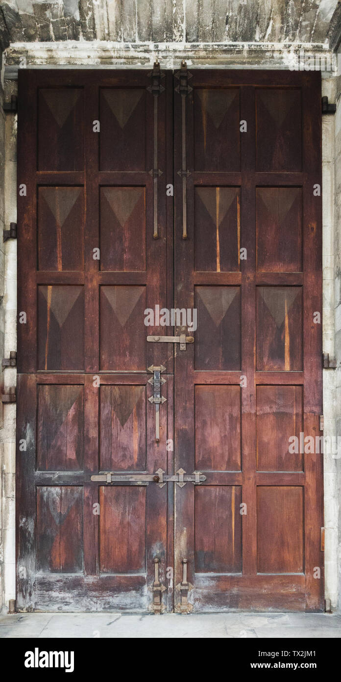 Big old wooden door with peeling varnish Stock Photo Alamy
