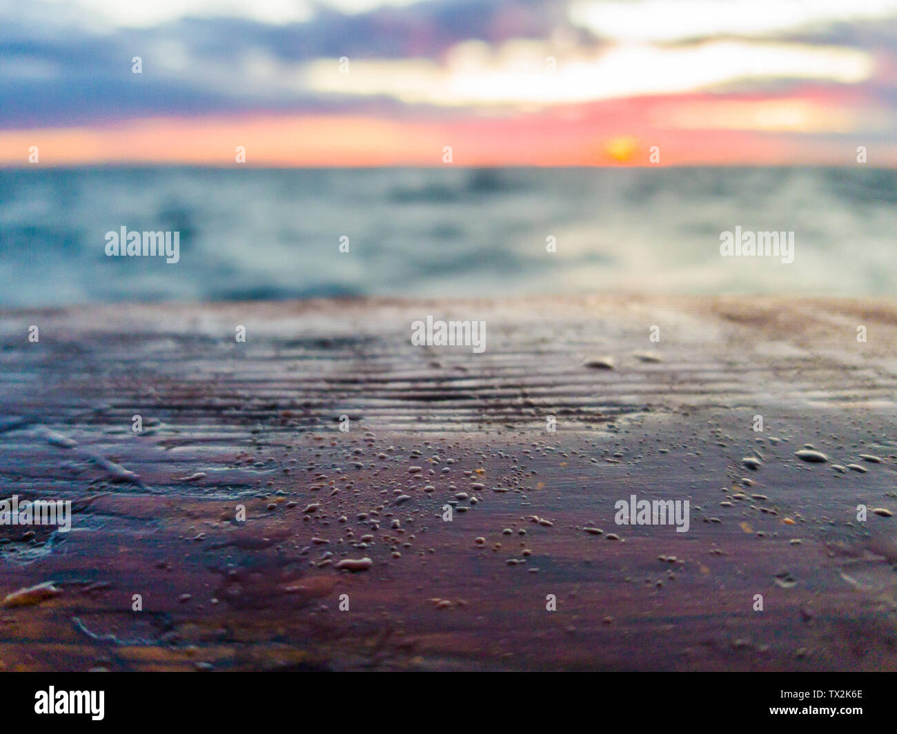 Water droplets on a wooden gunwale old sailing ship. Selective focus ...