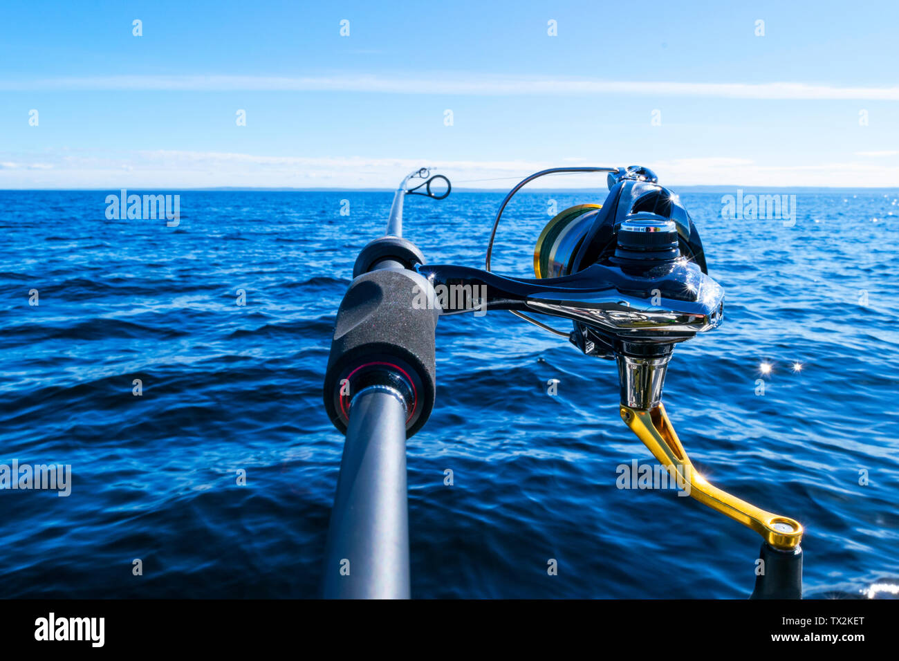 Fishing rod spinning with the line close-up. Fishing rod in rod holder in  fishing boat due the fishery day. Fishing rod rings. Fishing tackle.  Fishing Stock Photo - Alamy