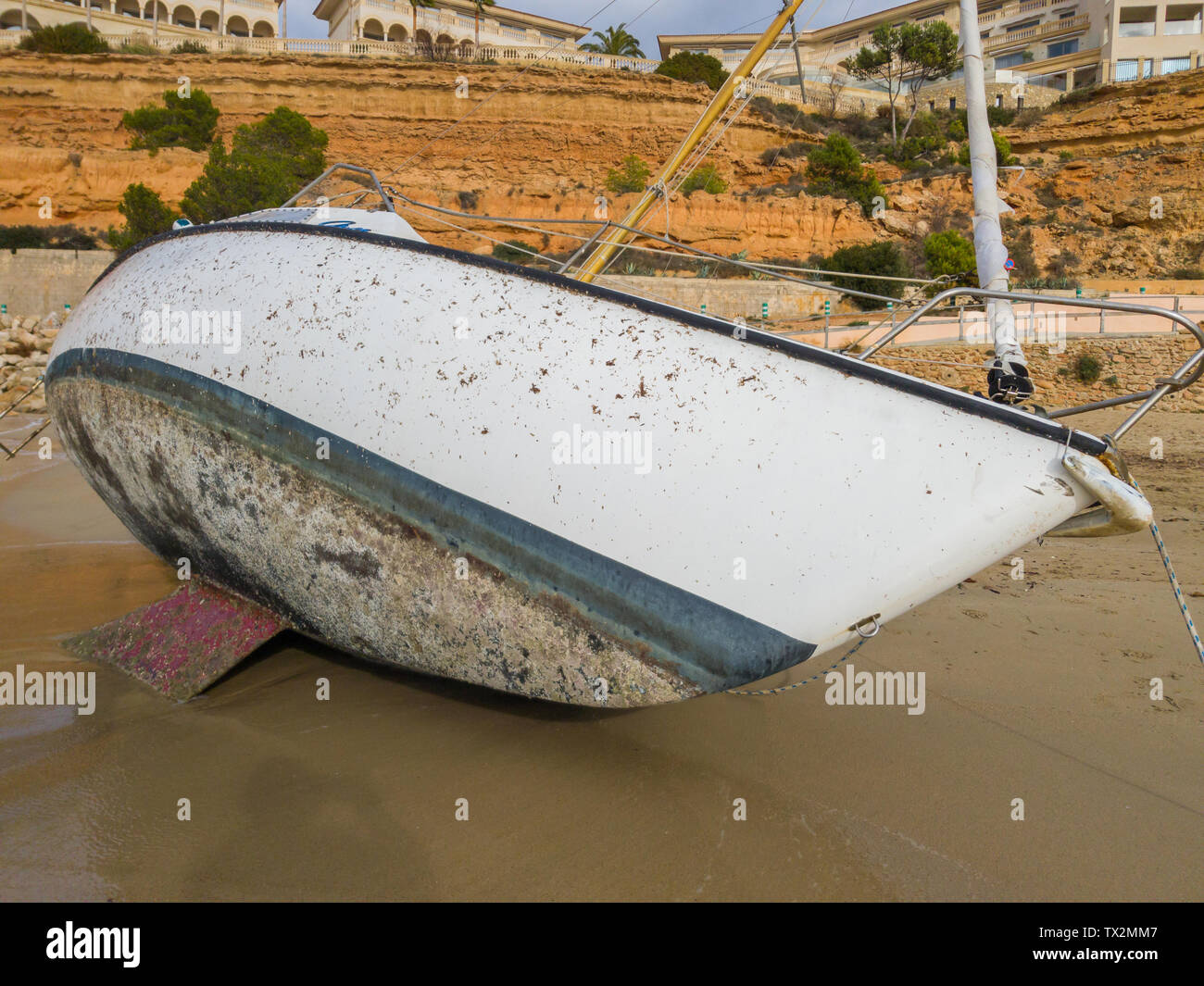 The bottom of the sailing yacht covered with shells. The surface of the