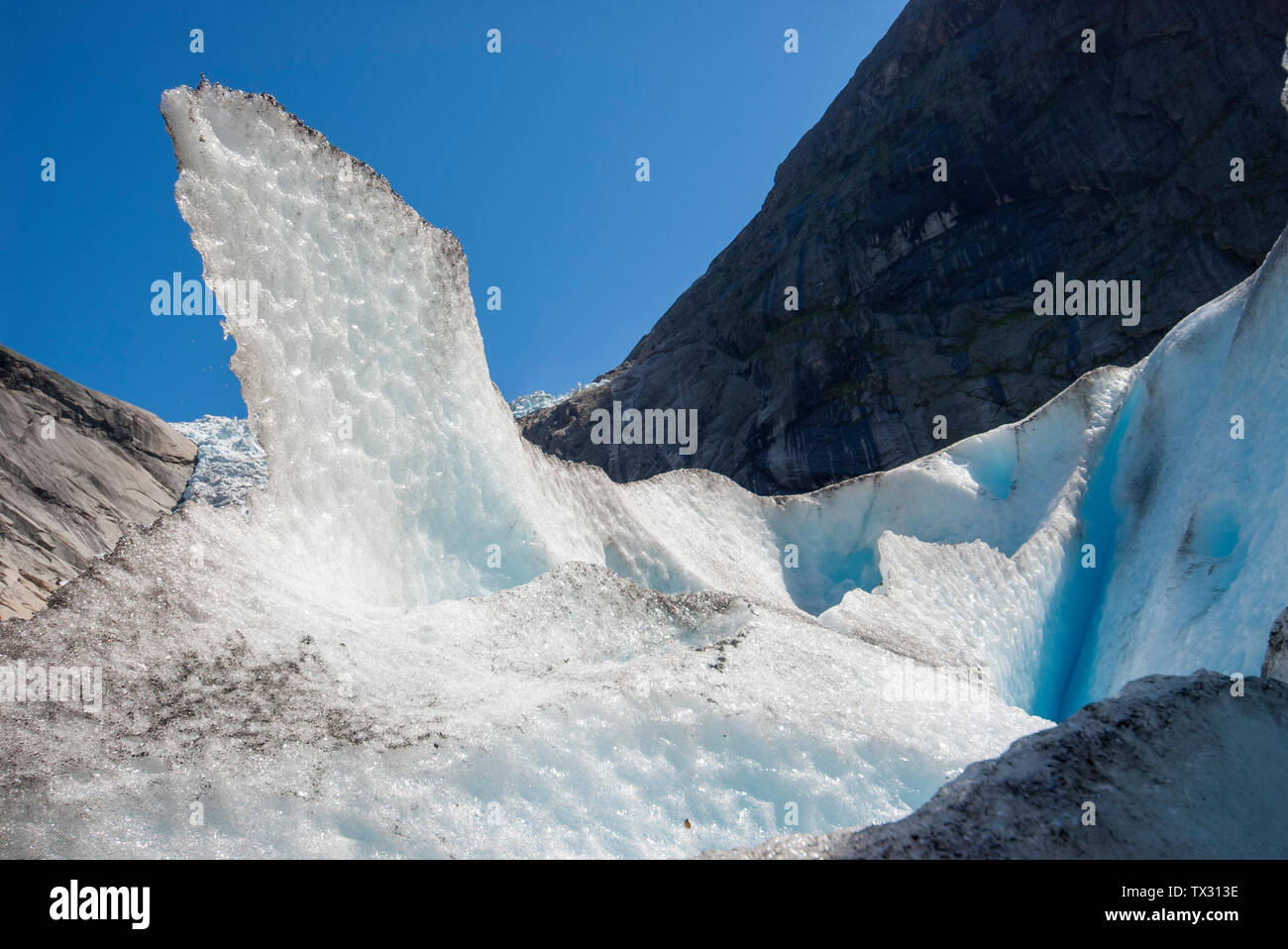 Ice peak on the Briksdal Glacier on a sunny summer's day in Norway Stock Photo