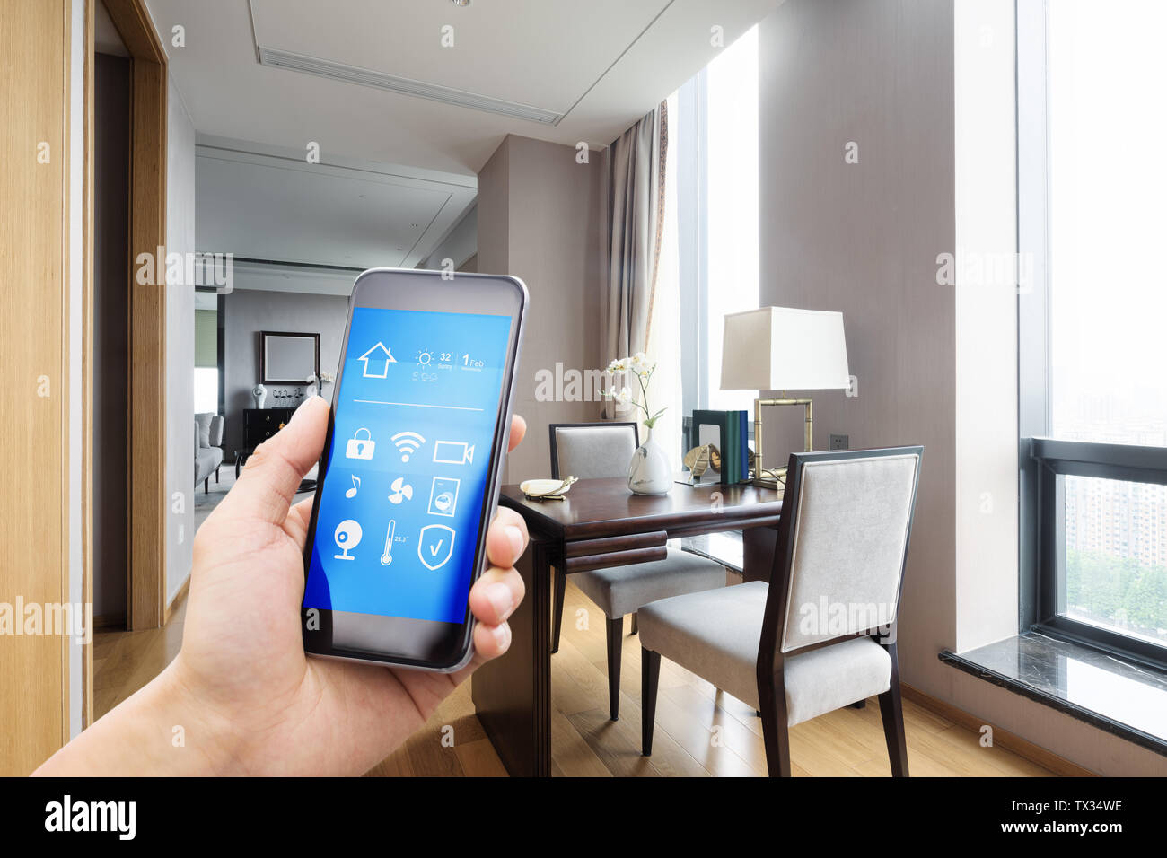 Using Phones In House mobile phone with living room in smart home Stock Photo - Alamy