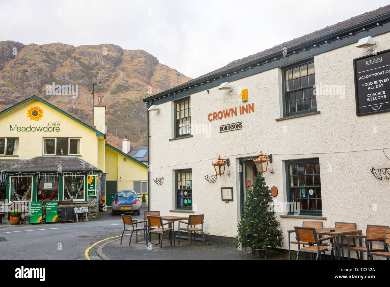 Village of Coniston in the Lake District on a winters day with Crown Inn public house and local cafe restaurant, Coniston,England Stock Photo