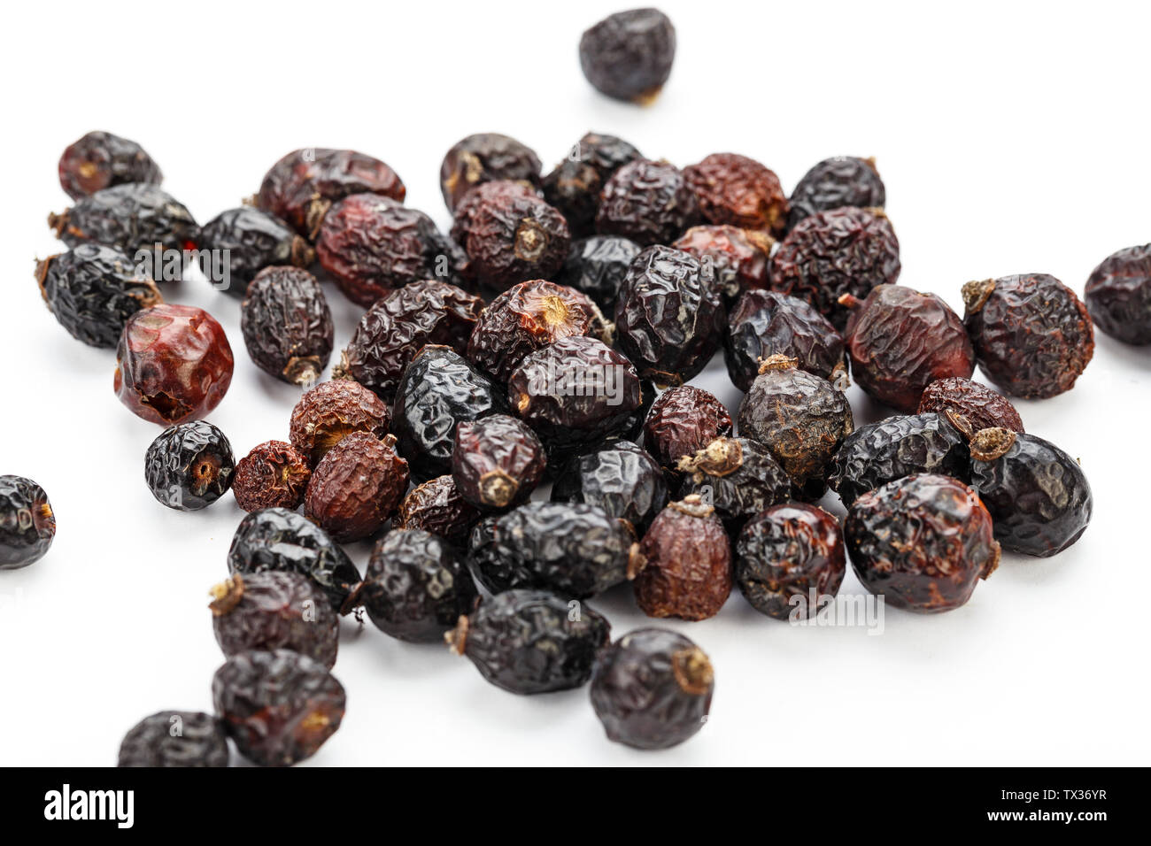 dried rose hips isolated on white background Stock Photo Alamy