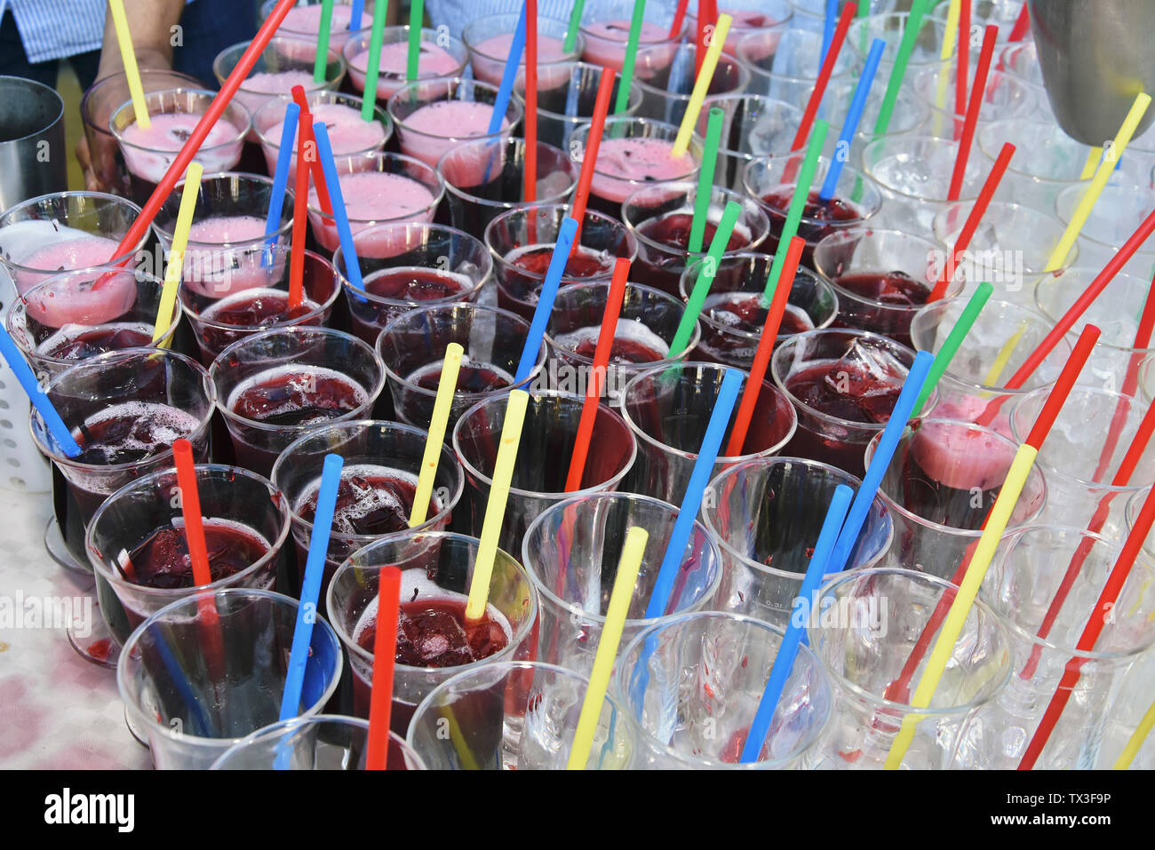 Multi colored straws in cocktails Stock Photo