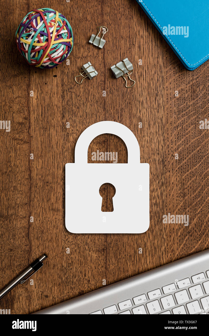 View from above paper padlock on wooden desk Stock Photo