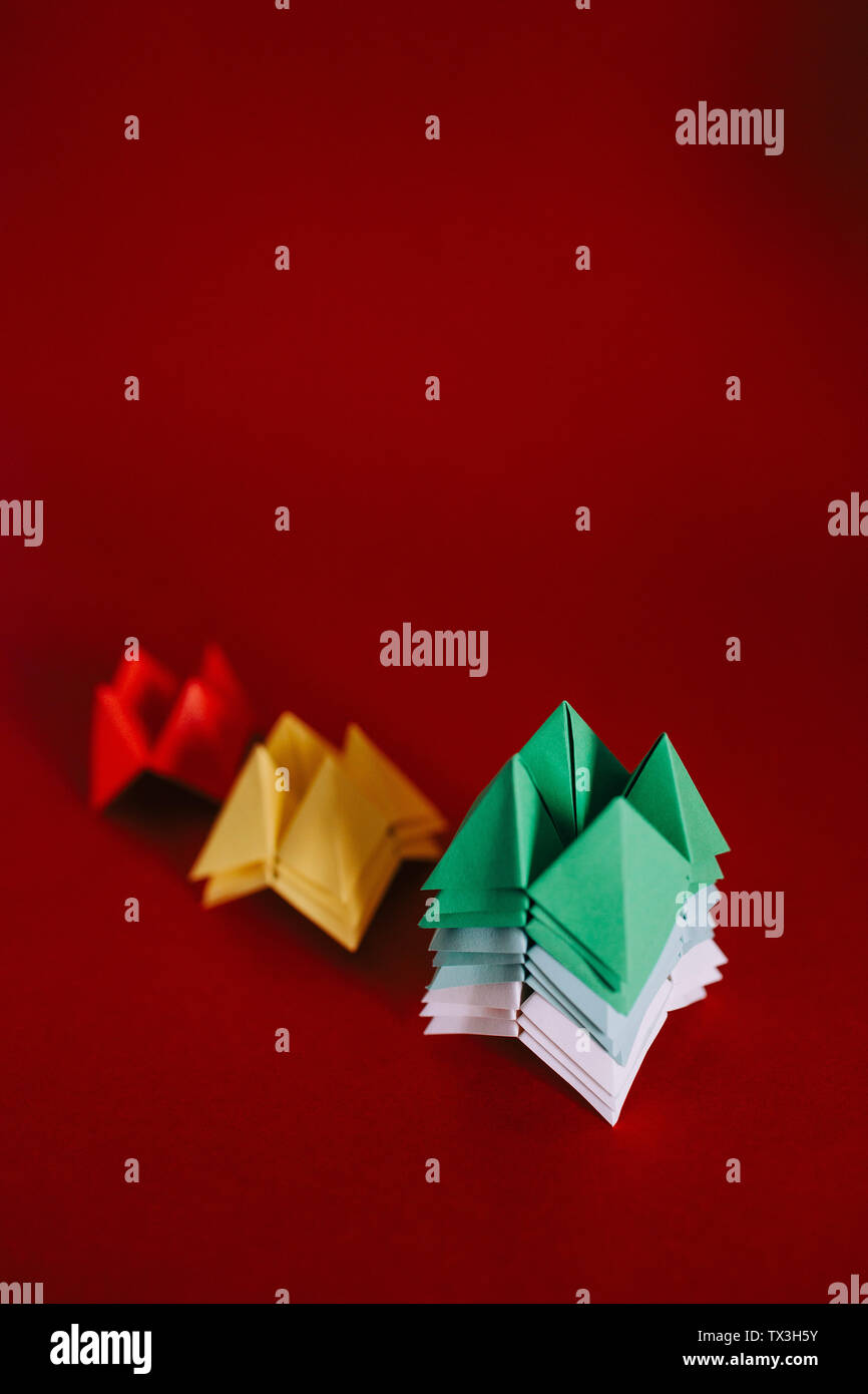 Multicolored origami fortune tellers on red background Stock Photo