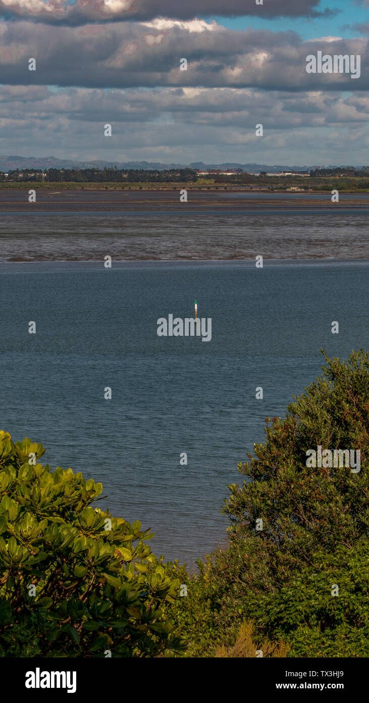 Long range vertical image of the Manukau Harbour landscape in Auckland NewZealand shot during a cloudy day Stock Photo