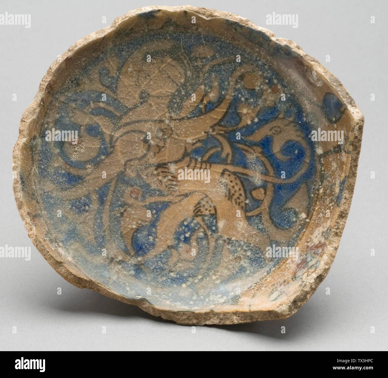 Fragment of a Bowl (image 2 of 2);  Syria or Turkey, 13th century Furnishings; Serviceware Fritware, underglaze-painted Height 1 3/4 in. Diameter 4 1/2 in. Gift of William Lillys in Memory of Edward L. B. Terrace (M.83.251.14) Islamic Art; 13th century date QS:P571,+1250-00-00T00:00:00Z/7; Stock Photo