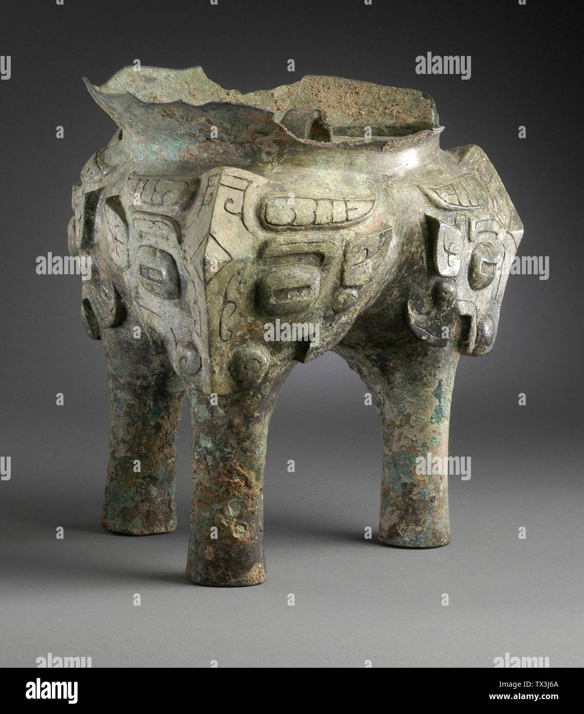 Fragment of a Ritual Grain Steamer (Yan) with Masks; China, Late Shang dynasty, late Anyang phase, or early Western Zhou dynasty, about 1100-950 B.C.  Jewelry and Adornments; masks Cast bronze 8 1/8 x 7 1/4 in. (20.64 x 18.42 cm) Gift of Mr. and Mrs. Eric Lidow (AC1998.251.40) Chinese Art; between circa 1100 and circa 950 B.C.; Stock Photo
