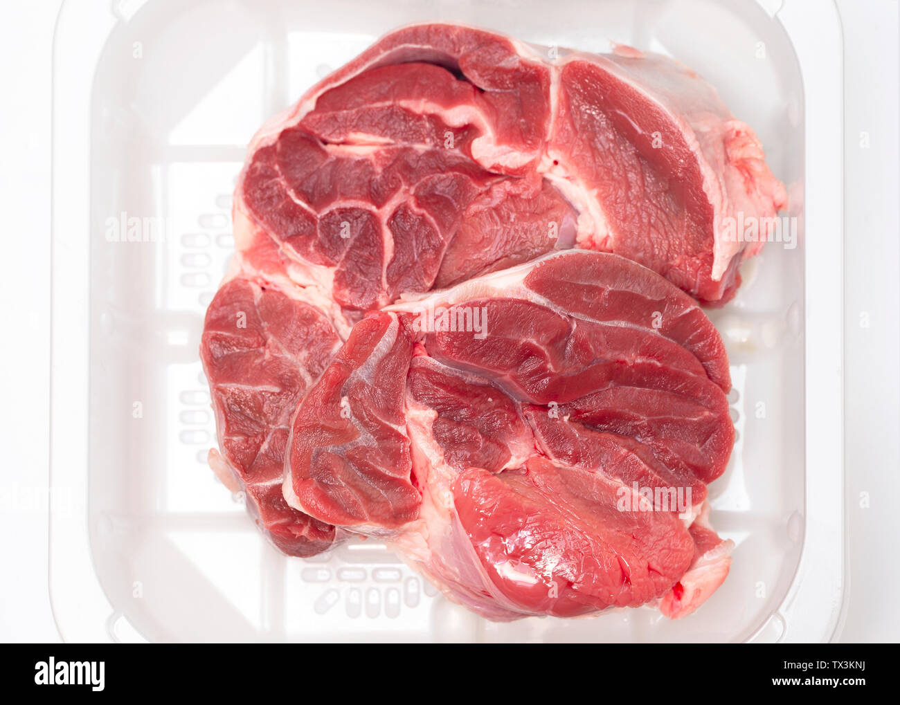 Boneless beef shank in a butcher's tray Stock Photo