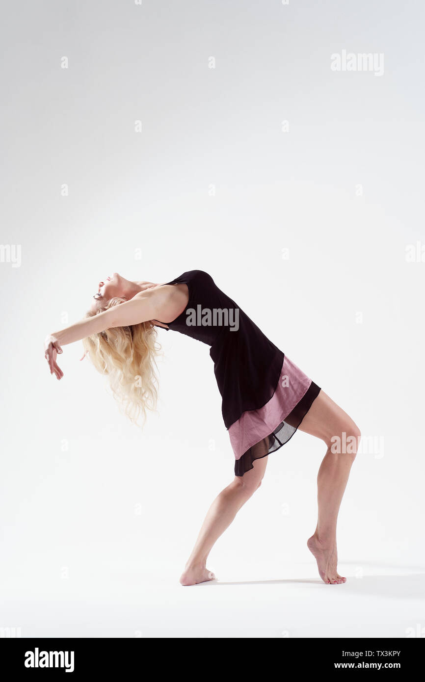 Young woman cute dancing pose hi-res stock photography and images - Alamy