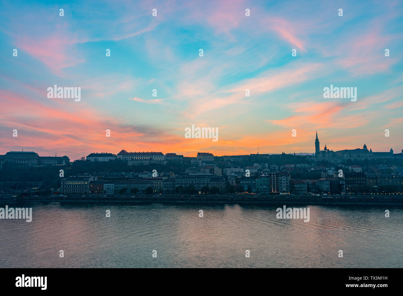 Sunset view of the Matthias Church and River Danube bank at Budapest, Hungary Stock Photo