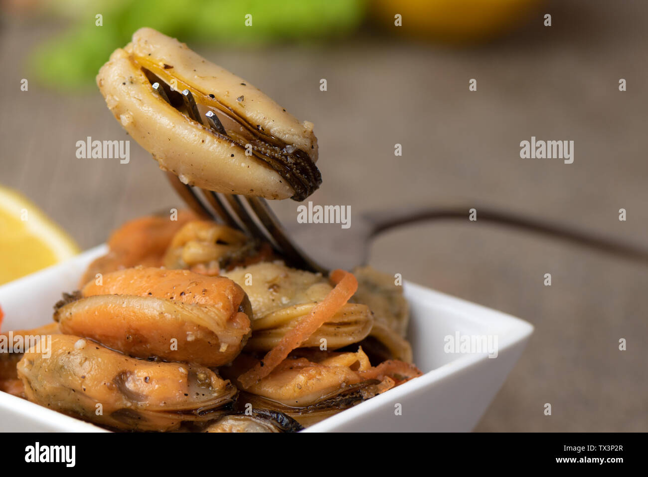 Pickled mussels with carrot, lemon juice and oil Stock Photo Alamy