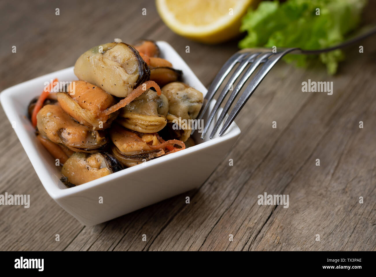 Pickled mussels with carrot, lemon juice and oil Stock Photo Alamy