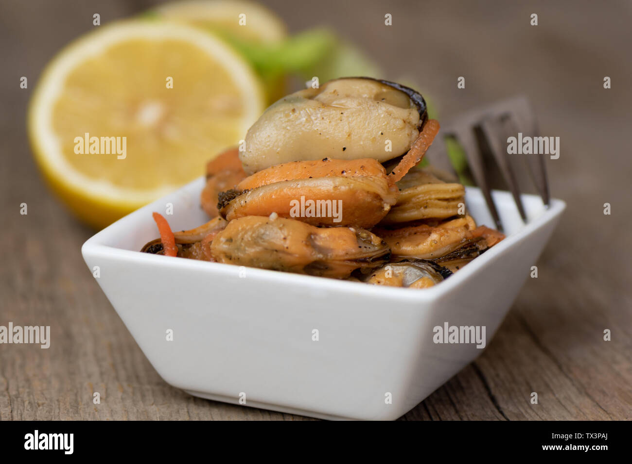 Pickled mussels with carrot, lemon juice and oil Stock Photo Alamy