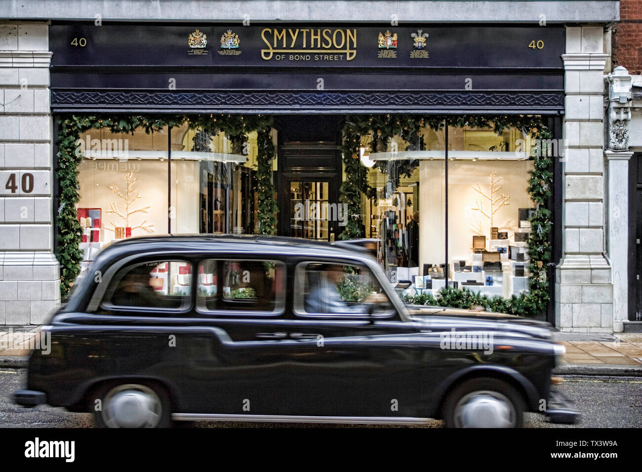 Smythson of Bond street and black cab London uk Stock Photo